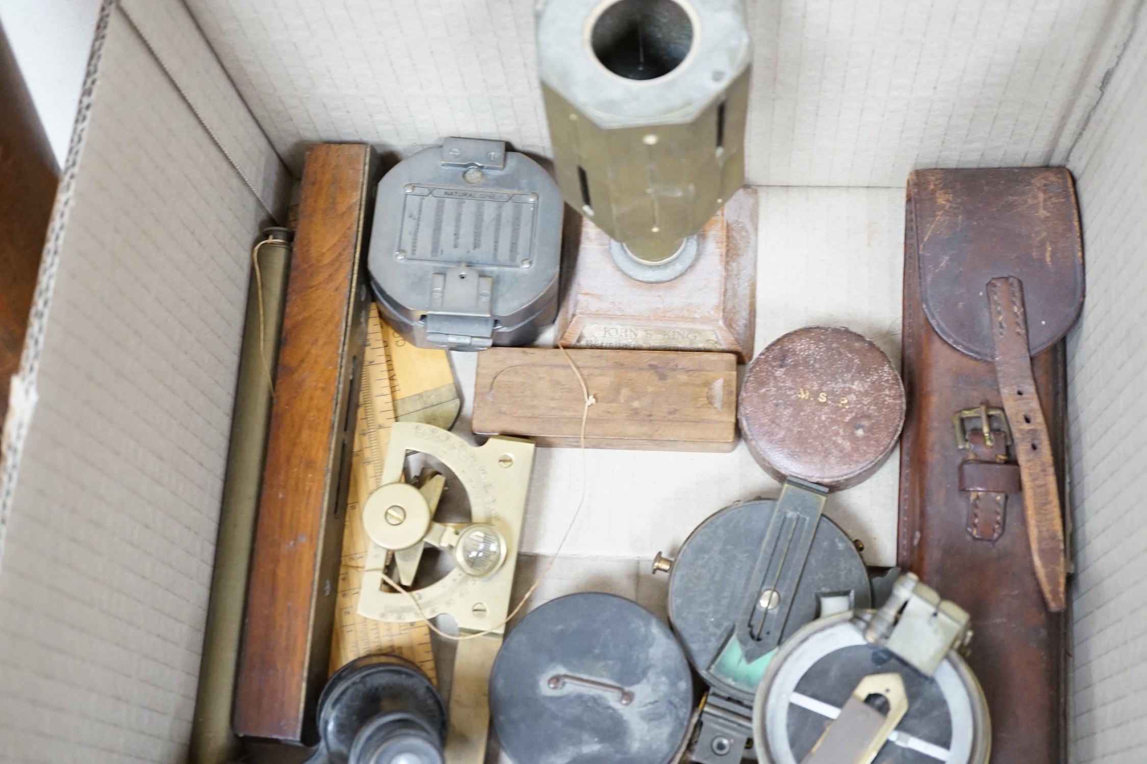 A group of surveying and scientific instruments, early 20th century, including and Elliot brothers London pocket sextant A in the Negretti and Zambra London compass, 80 Cook and Sons York and London level, military issue